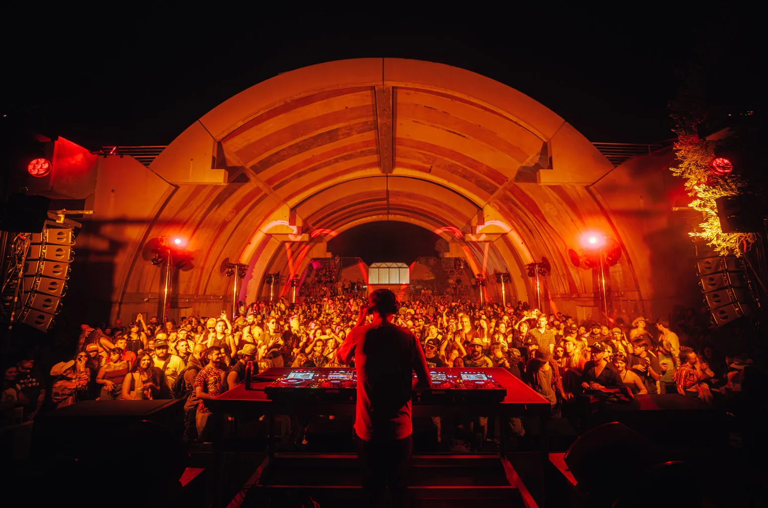 FORM Arcosanti festival crowd gathered in the desert amphitheater at dusk