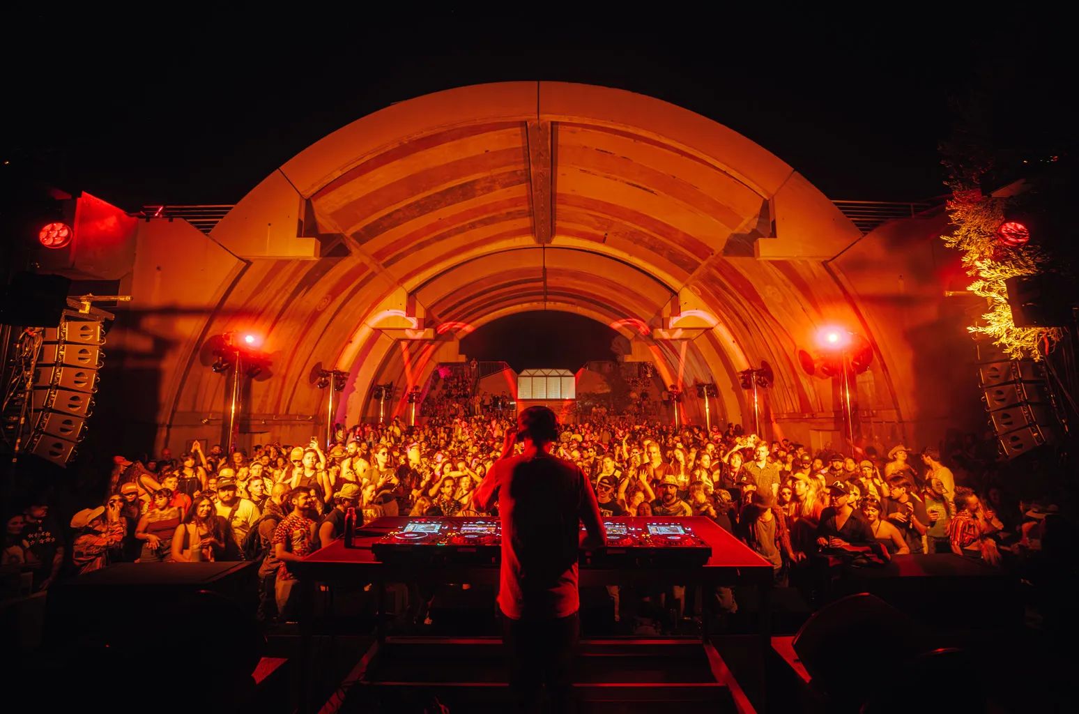 FORM Arcosanti festival crowd gathered in the desert amphitheater at dusk