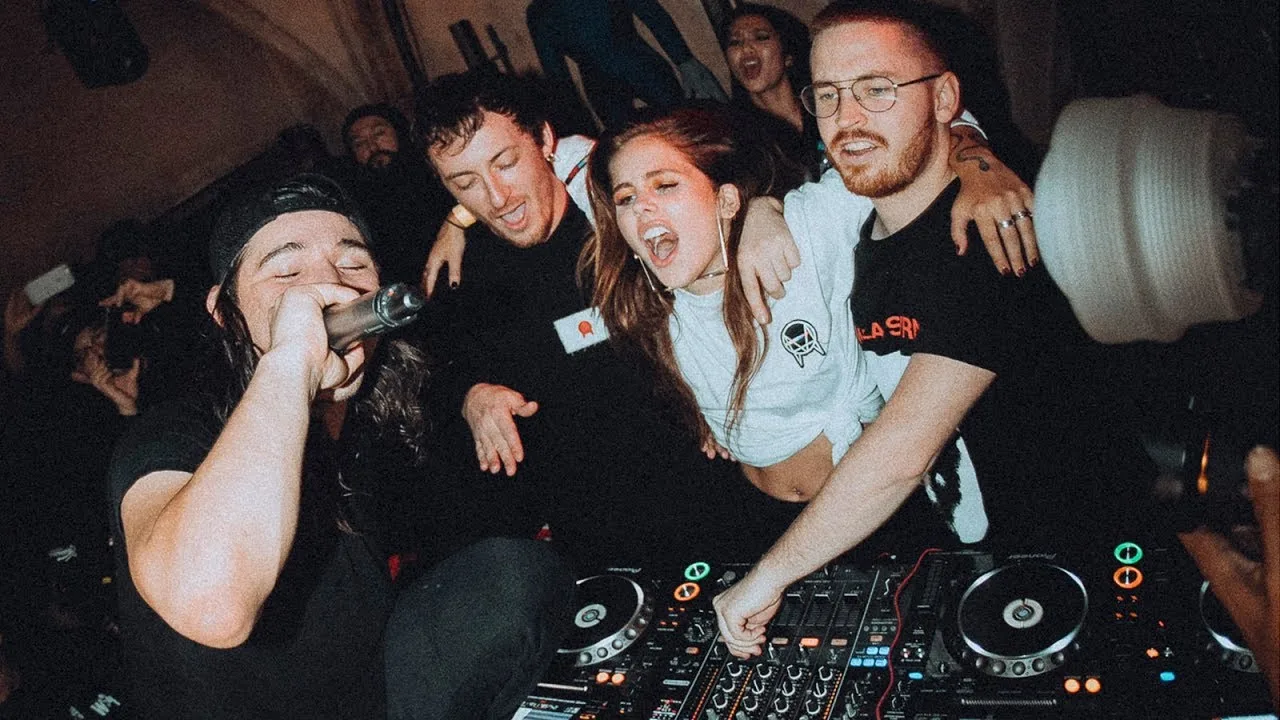 OWSLA label show with strobing stage lights over the crowd