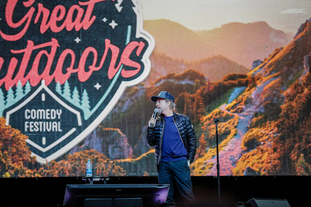 Great Outdoors Comedy Festival outdoor stage with an evening crowd