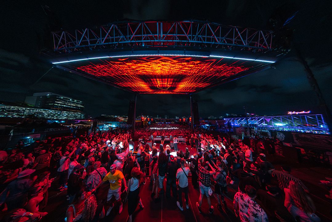 III Points Miami festival stage with vivid production lighting